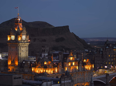 The Balmoral Hotel and Arthur's Seat at twilight