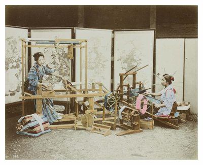 Two women weaving silk on looms