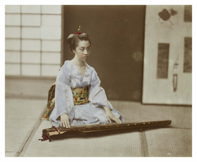 Young woman playing the koto