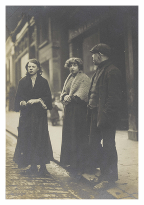 Three people standing in the street, Canongate