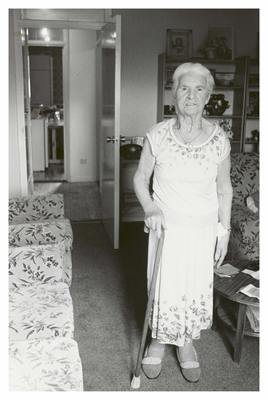 Elderly woman standing in living room, Wester Hailes