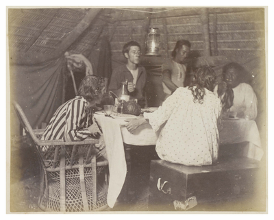 King dining with Stevenson party in camp at Apemama