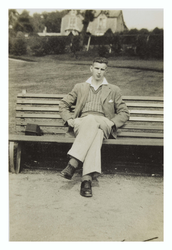 Portrait of Walter Lyle sat on park bench