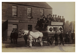 Horse-drawn bus with passengers