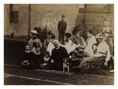 Group of people having tea on the lawn