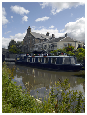 Canal boat and the Bridge Inn at Ratho