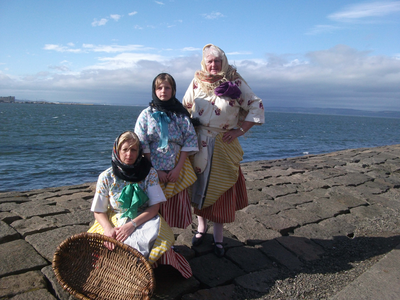 Three generations posed as Newhaven fisherfolk