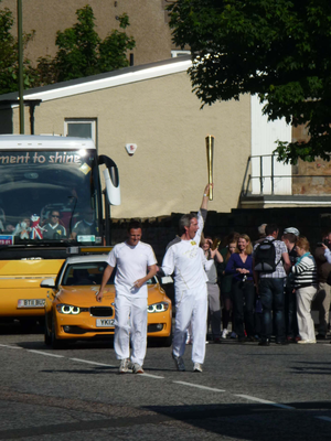 Olympic Torch Relay runners passing through Musselburgh