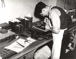 A bookbinder at work in his printer's workshop