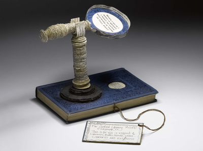 The seventh paper book sculpture: Magnifying glass