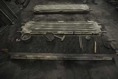 Foundry tools laying on a casting mould