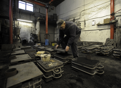 Weights being placed on the casting moulds