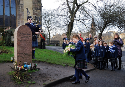 Schoolgirls from George Heriot's School laying a wreath