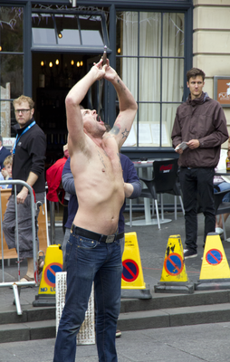 Street performer swallowing a sword, Edinburgh Fringe