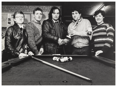 Group portrait beside a pool table, Wester Hailes