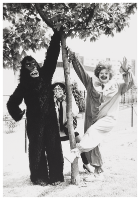 People dressed up as a gorilla, clown and a schoolgirl