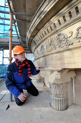 George Morrison, architect inspecting stonework
