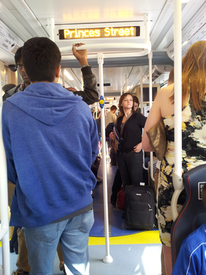 Interior of a tram filled with passengers