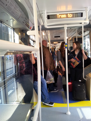 Interior of a tram filled with passengers