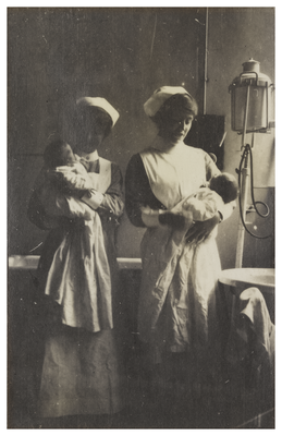 Nurses carrying babies