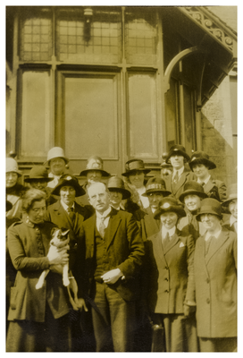 Group of health visitors with a man, woman and dog
