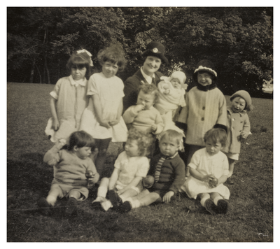 Mary Cunningham surrounded by children in Spylaw Park