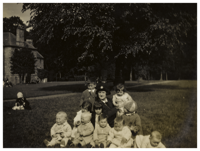 Mary Cunningham surrounded by children in Spylaw Park