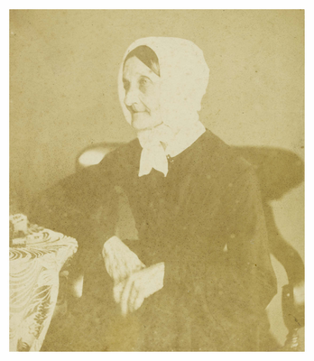 Elderly woman, seated, unidentified