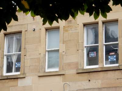 Vote Naw posters in a tenement window