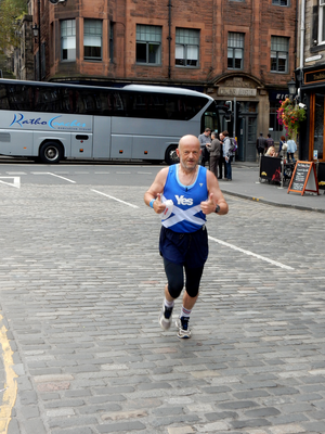 Jogger in Grassmarket with Yes vest on