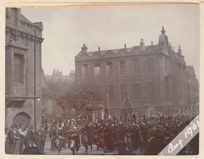 A Pipe Band marching past Canongate Church
