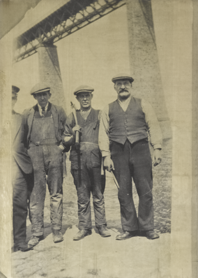 Four construction workers at the Forth Rail Bridge