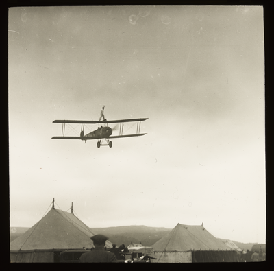 A wing-walker on an Avro 504 plane at a flying circus