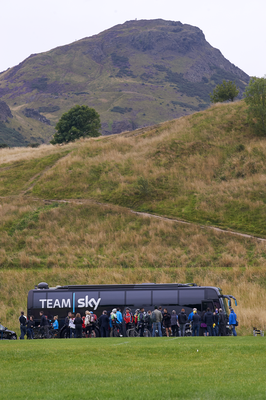 Team Sky bus in Holyrood Park, Arthur's Seat behind