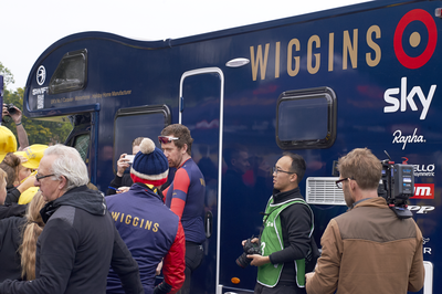Sir Bradley Wiggins signs autographs at the team bus