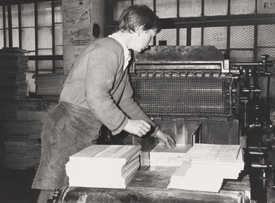 An employee operating machinery at Wm. Cummings & Son
