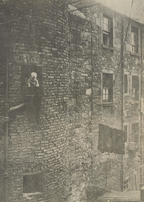 Boy at an outside sink - a picture of old Leith
