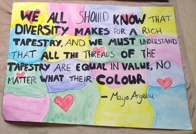 Maya Angelou quote on cardboard placard