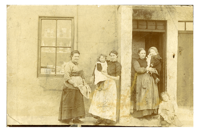 Three women and children outside a Newhaven shop