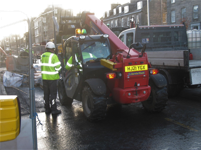Construction worker and vehicle on Leith Walk
