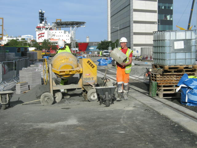 Ocean Terminal, workman carrying concrete block
